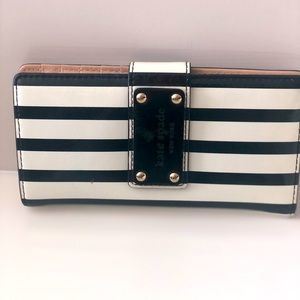 I love this wallet! Never used because it was too pretty. Kate Spade New York.